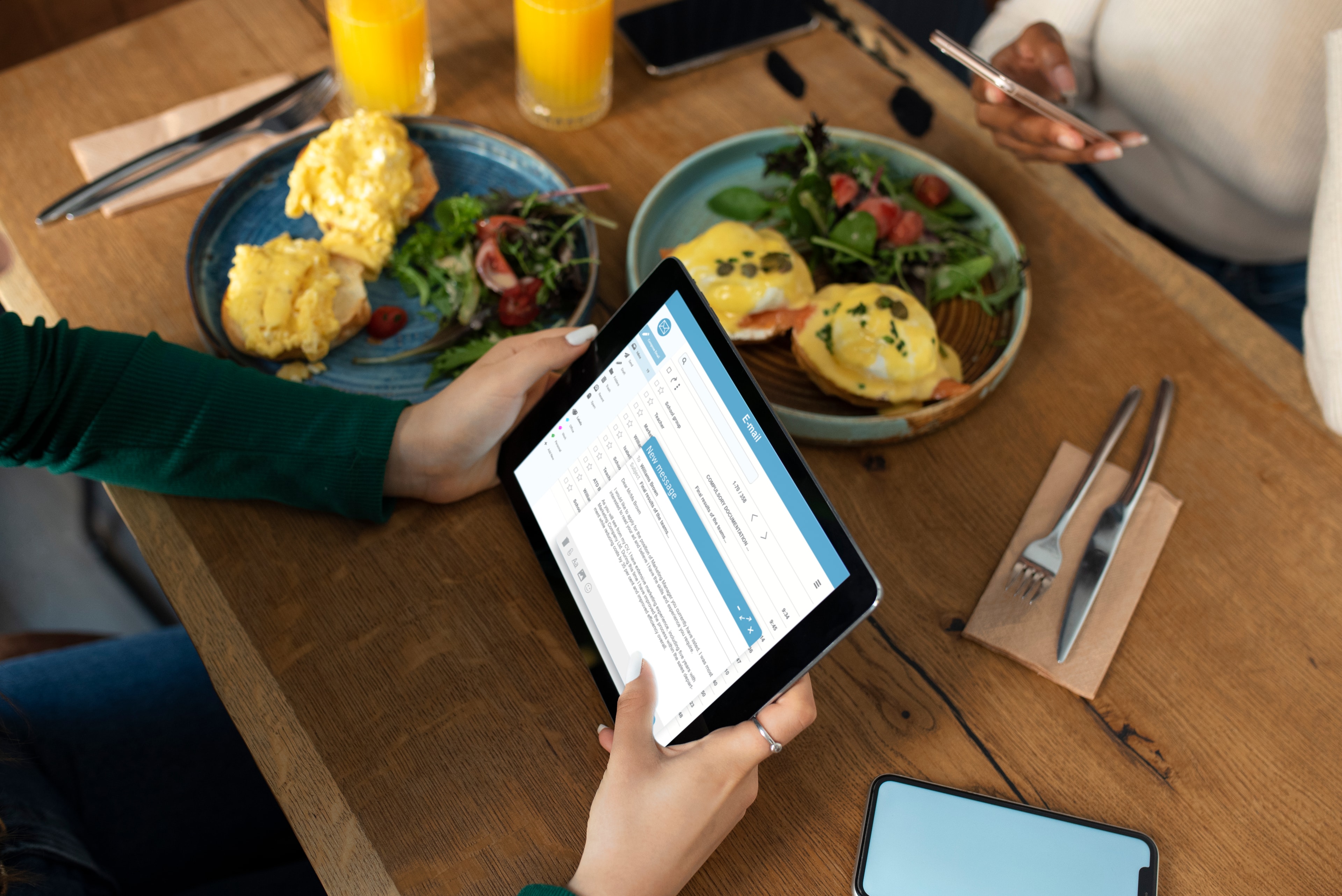 Restaurant owner viewing analytics on tablet